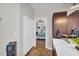 Bathroom with modern vanity and view into a bedroom with ensuite bath at 645 S 54Th St, Mesa, AZ 85206