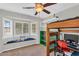 Bedroom with a bunk bed, window seating, and carpeted floors at 645 S 54Th St, Mesa, AZ 85206