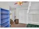 This bedroom features carpet, and a ceiling fan, with an open door to the hallway and a closet at 645 S 54Th St, Mesa, AZ 85206