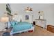 Bright bedroom featuring a ceiling fan, a decorative headboard, and a matching dresser at 645 S 54Th St, Mesa, AZ 85206