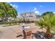 Inviting two-story home with a red front door, covered porch, and manicured landscaping, including a mailbox by the driveway at 645 S 54Th St, Mesa, AZ 85206