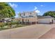 Beautiful two-story house with a covered porch, well-maintained lawn, and a two-car garage, perfect for a growing Gathering at 645 S 54Th St, Mesa, AZ 85206