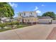 Charming two-story home with a welcoming front porch, manicured lawn, and an attached two-car garage at 645 S 54Th St, Mesa, AZ 85206
