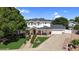 Impressive two-story home with a welcoming front porch, manicured landscaping, and a spacious driveway leading to a garage at 645 S 54Th St, Mesa, AZ 85206
