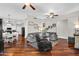 Spacious living room featuring hardwood floors, comfortable seating, and a ceiling fan at 645 S 54Th St, Mesa, AZ 85206