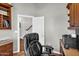 Comfortable office area showcasing a modern, cushioned chair and a view of the staircase at 645 S 54Th St, Mesa, AZ 85206