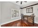 Office space with custom bar, hardwood floors, plantation shutters, and natural light at 645 S 54Th St, Mesa, AZ 85206