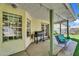 Outdoor patio features a built-in porch swing, brick trim, and a barbecue area ideal for entertaining guests at 645 S 54Th St, Mesa, AZ 85206