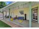 Covered patio space with hanging porch swings, ample storage, and easy access to backyard, great for relaxation and leisure at 645 S 54Th St, Mesa, AZ 85206