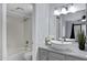 Bright bathroom featuring a modern vanity with vessel sink and shower over tub at 850 S River Dr # 1068, Tempe, AZ 85281