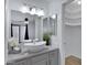 Bright bathroom features a modern vanity with vessel sink and walk-in closet at 850 S River Dr # 1068, Tempe, AZ 85281