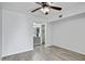 Bedroom featuring hard wood floors, ceiling fan, and an attached bathroom at 850 S River Dr # 1068, Tempe, AZ 85281