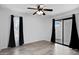Spacious bedroom with wood-look flooring and sliding door access to patio at 850 S River Dr # 1068, Tempe, AZ 85281