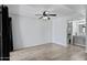 Bedroom featuring hardwood floors, ceiling fan and an attached bathroom at 850 S River Dr # 1068, Tempe, AZ 85281