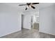 Open bedroom layout with wood-look floors leading to a bathroom at 850 S River Dr # 1068, Tempe, AZ 85281
