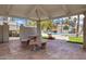 Charming poolside cabana with stone table and seating, perfect for relaxation and entertaining by the pool at 850 S River Dr # 1068, Tempe, AZ 85281
