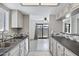 Modern kitchen with a view to the living room and sliding glass door at 850 S River Dr # 1068, Tempe, AZ 85281