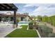 Lush backyard featuring a pool, manicured lawn, and charming landscaping, perfect for outdoor living at 8821 E Havasupai Dr, Scottsdale, AZ 85255