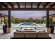 Inviting outdoor space with fire pit, pool, and comfortable seating at 8821 E Havasupai Dr, Scottsdale, AZ 85255