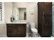 Cozy bathroom features wood vanity, marble countertops, and decorative cacti art at 8821 E Havasupai Dr, Scottsdale, AZ 85255