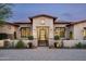 Charming front entrance featuring a decorative gate and manicured landscaping at 8821 E Havasupai Dr, Scottsdale, AZ 85255