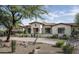 Beautiful home featuring a tile roof, desert landscaping, and a brick driveway at 8821 E Havasupai Dr, Scottsdale, AZ 85255