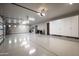 Spacious three-car garage with ample storage cabinets and an epoxy floor at 8821 E Havasupai Dr, Scottsdale, AZ 85255