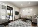 Comfortable living room with a plush sofa and a patio view at 8821 E Havasupai Dr, Scottsdale, AZ 85255
