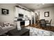 Open-concept living room with a kitchenette, seating area, and dining space at 8821 E Havasupai Dr, Scottsdale, AZ 85255