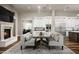 Cozy living room with fireplace and dining area, perfect for Gathering gatherings and entertaining at 8821 E Havasupai Dr, Scottsdale, AZ 85255