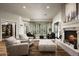 Elegant living room featuring a fireplace, wine cellar, and comfortable seating at 8821 E Havasupai Dr, Scottsdale, AZ 85255