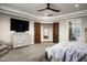 Spacious main bedroom with a seating area, TV, and ensuite bathroom at 8821 E Havasupai Dr, Scottsdale, AZ 85255