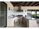 Well-equipped outdoor kitchen featuring stainless steel appliances and beautiful tile backsplash at 8821 E Havasupai Dr, Scottsdale, AZ 85255