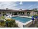 Beautiful backyard with a sparkling pool and a covered patio perfect for outdoor entertaining at 8821 E Havasupai Dr, Scottsdale, AZ 85255