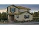 Charming two-story home with stone accents, desert landscaping, and neutral color palette at 9952 W Piccadilly Rd, Avondale, AZ 85392