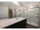 Modern bathroom featuring a sleek vanity and a glass-enclosed shower, designed for comfort at 1102 W West Virginia Ave, Florence, AZ 85132