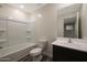 Clean bathroom with a tub-shower combo, toilet, and vanity with ample lighting at 1102 W West Virginia Ave, Florence, AZ 85132