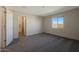 Cozy bedroom with neutral carpet and window, next to the bathroom and closet at 1102 W West Virginia Ave, Florence, AZ 85132