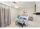 Neutral bedroom with an area rug and natural light, showcasing minimalist decor at 12501 E Cloud Rd, Chandler, AZ 85249