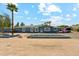 Charming single-story home with blue exterior and desert landscaping under a bright blue sky at 12501 E Cloud Rd, Chandler, AZ 85249