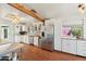 Bright kitchen featuring stainless steel appliances, white cabinets, and wood countertops at 12501 E Cloud Rd, Chandler, AZ 85249