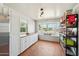 Bright, well-lit kitchen featuring a window seat and natural wood floors, adding character at 12501 E Cloud Rd, Chandler, AZ 85249
