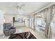 Bright kitchen with white appliances, white cabinets, and large windows at 12501 E Cloud Rd, Chandler, AZ 85249