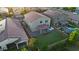 Aerial view showcasing the home's spacious backyard, outdoor kitchen, and proximity to neighborhood amenities at 13553 N 141St Ln, Surprise, AZ 85379