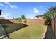 Large, well-maintained backyard with block wall and desert landscaping, offering privacy and ample space at 13553 N 141St Ln, Surprise, AZ 85379