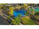Aerial view of a blue basketball court with trees surrounding it, located near the community pool at 13553 N 141St Ln, Surprise, AZ 85379