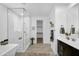 Elegant bathroom featuring a walk-in shower and a soaking tub with natural lighting at 13553 N 141St Ln, Surprise, AZ 85379