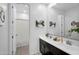 This bathroom features double sinks and a shower with curtain at 13553 N 141St Ln, Surprise, AZ 85379