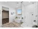 Modern bathroom featuring a glass shower, soaking tub, and stylish tile work at 13553 N 141St Ln, Surprise, AZ 85379