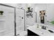 This bathroom offers a sink, vanity, toilet, and a glass enclosed shower at 13553 N 141St Ln, Surprise, AZ 85379